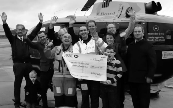 Charity group receiving a donation cheque from Plymouth Brethren Christian Church