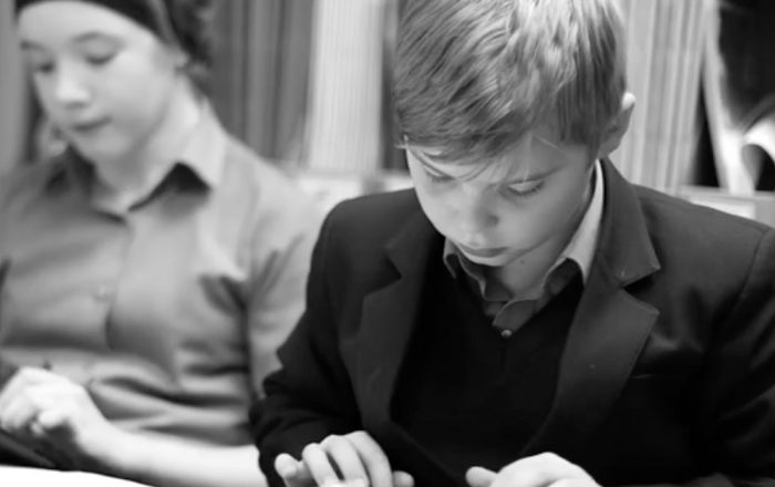 Plymouth Brethren child studying at school