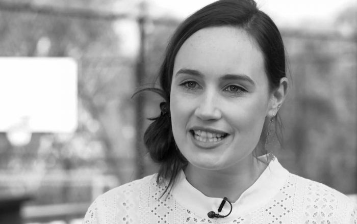 Jess from OneSchool Global speaking to camera