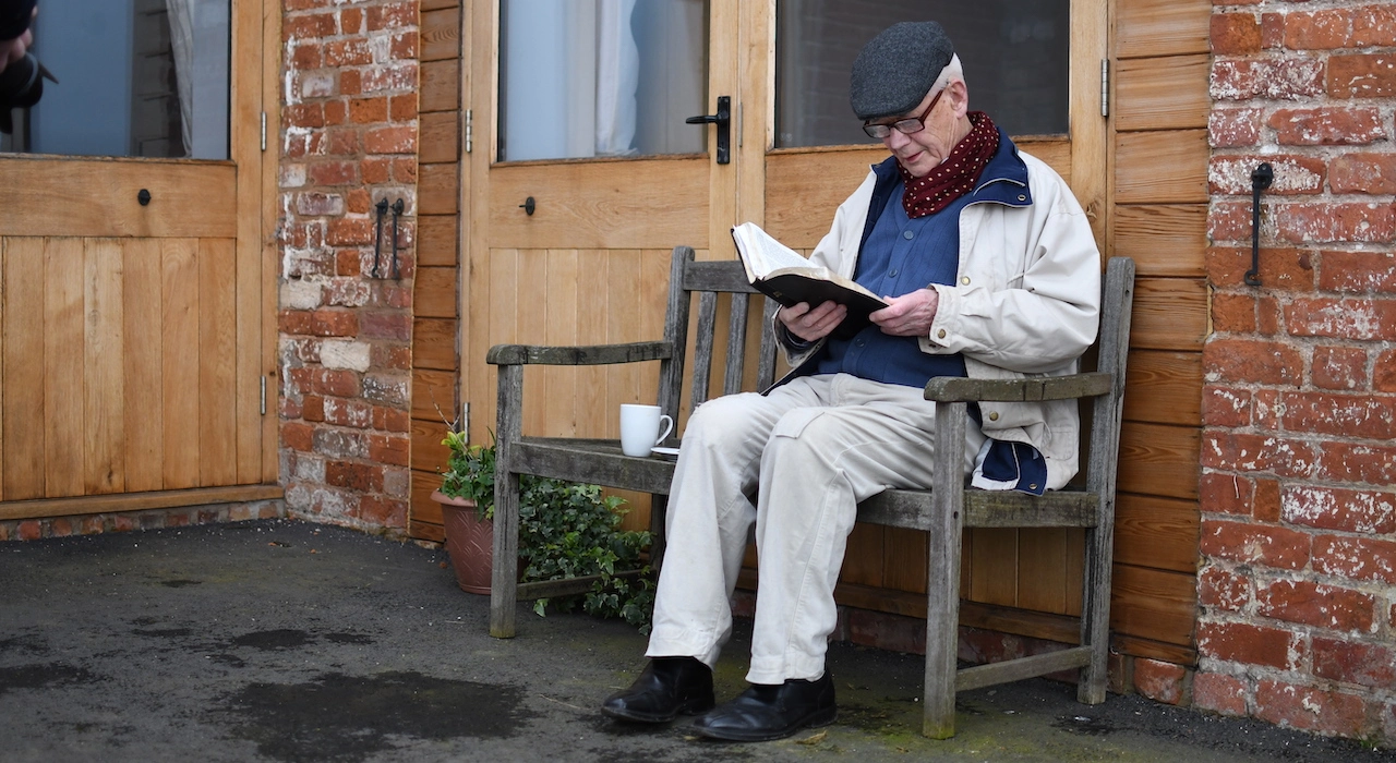 Plymouth Brethren elderly member reading Bible